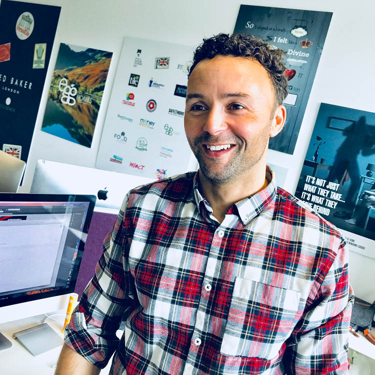 Nick, designer and founder of BMB Creative, in his studio